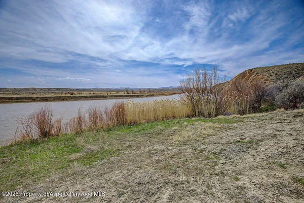 a view of a lake with a beach