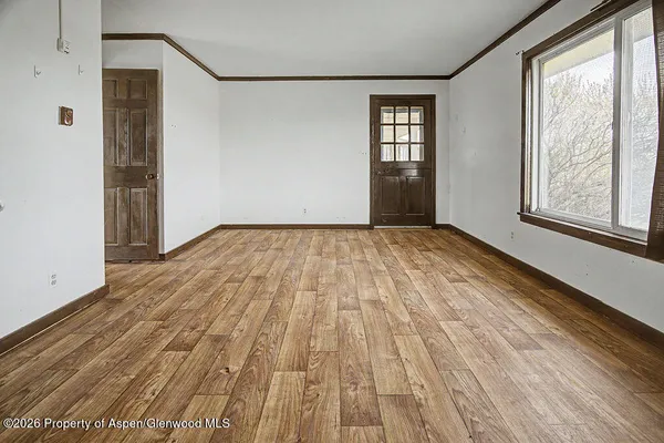 a view of an empty room with a window