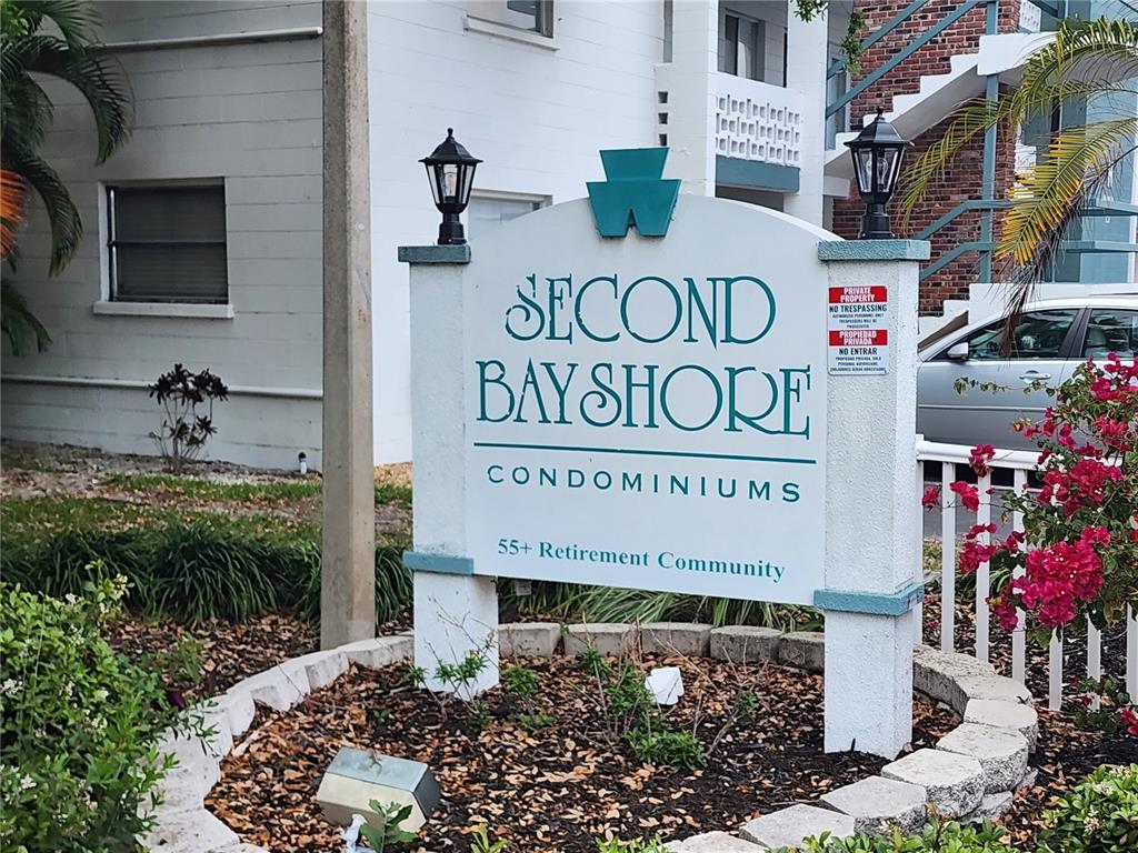 5842 Welcome Road, Unit J2 Bradenton, FL 34207 - Photo 1 of 25 a sign on the side of a building