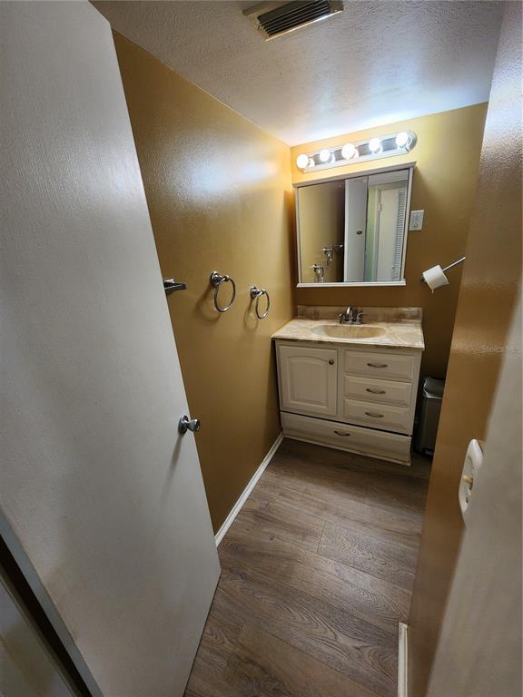 5842 Welcome Road, Unit J2 Bradenton, FL 34207 - Photo 16 of 25 a bathroom with a double vanity sink and mirror