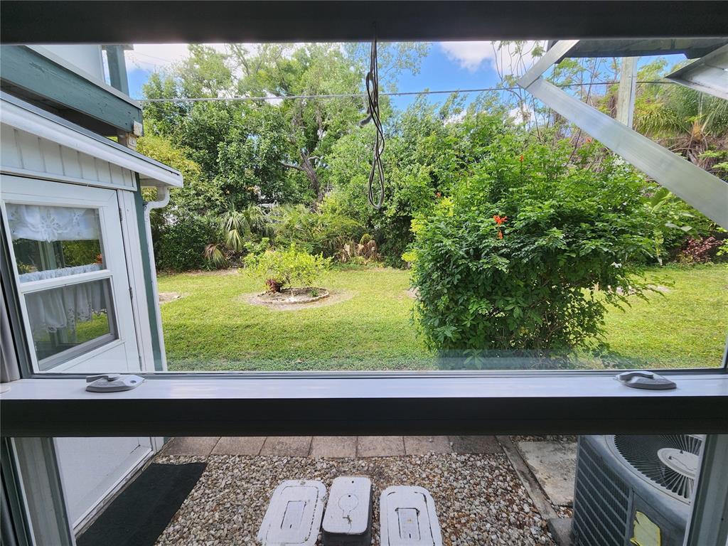 5842 Welcome Road, Unit J2 Bradenton, FL 34207 - Photo 24 of 25 a view of a back yard from a window