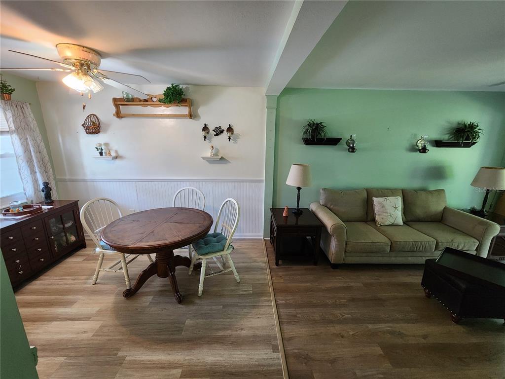 5842 Welcome Road, Unit J2 Bradenton, FL 34207 - Photo 8 of 25 a living room with furniture and a table