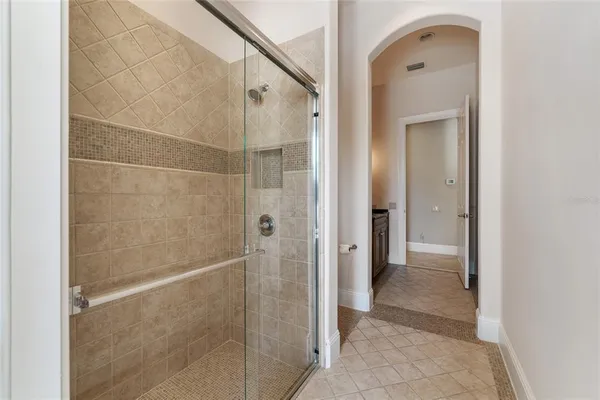 a bathroom with a shower and a sink