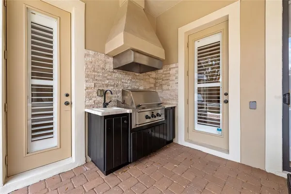a kitchen with stainless steel appliances a stove and a microwave