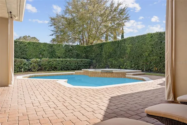 a view of a swimming pool with an outdoor space