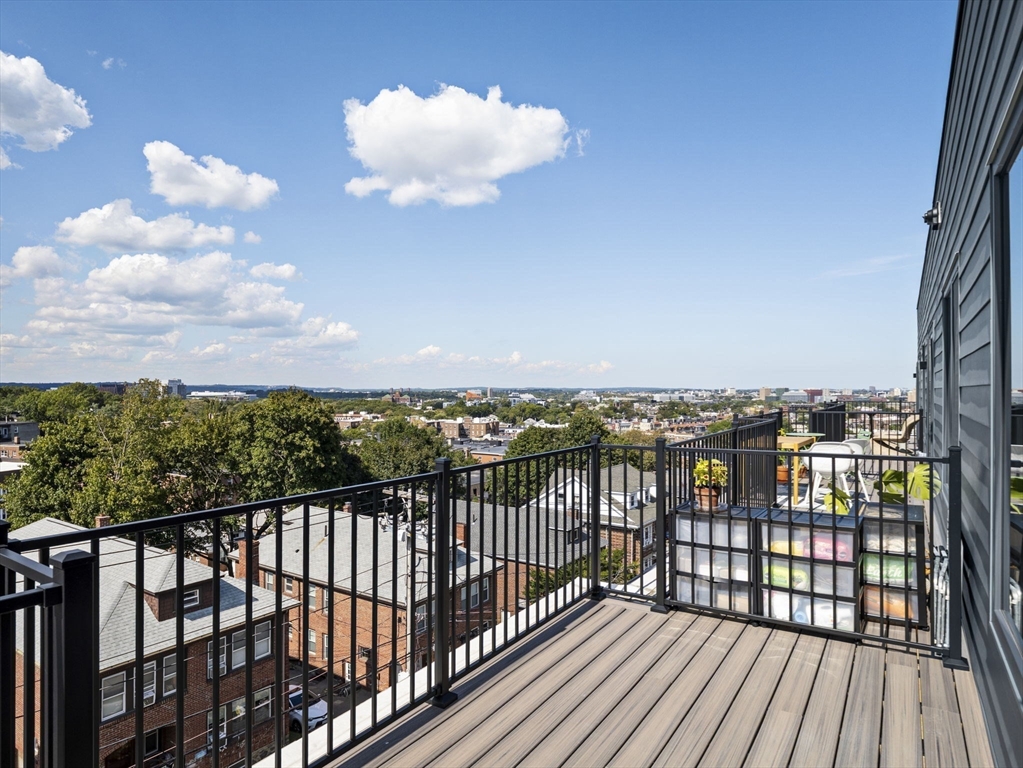 249 Corey Road, Unit 401 Boston, MA 02135 - Photo 1 of 34 a view of city from a balcony