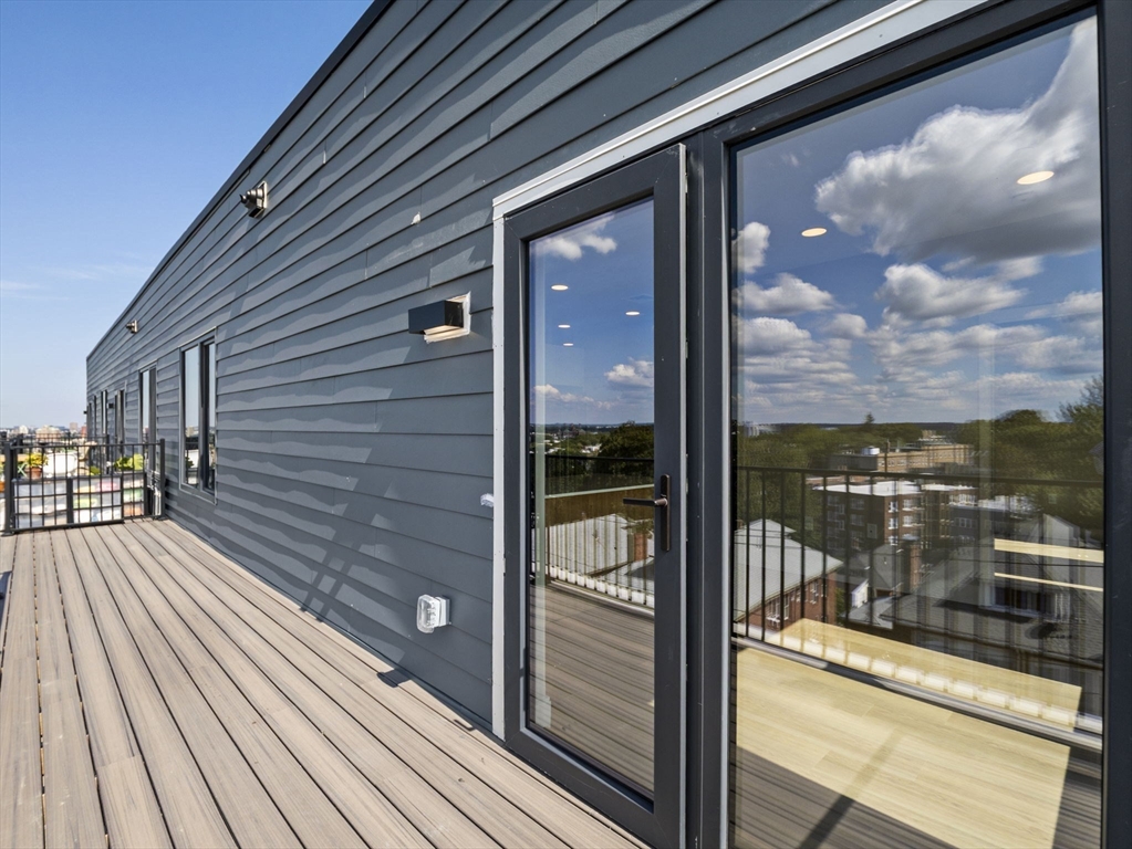 249 Corey Road, Unit 401 Boston, MA 02135 - Photo 25 of 34 a view of a balcony from a room