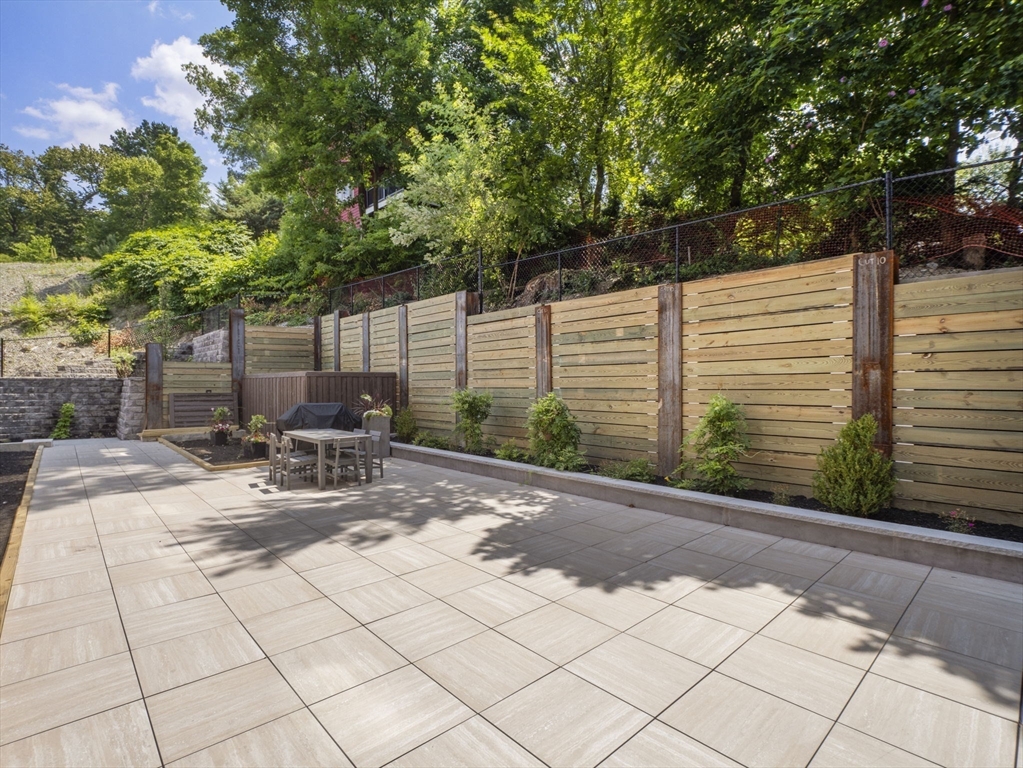 249 Corey Road, Unit 401 Boston, MA 02135 - Photo 32 of 34 a garden view with a seating space