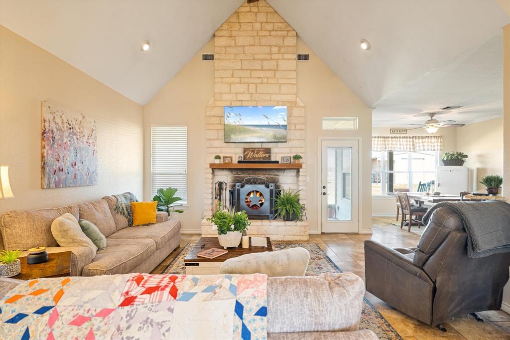 2885 Enloe Road Howe, TX 75459 - Photo 3 of 39 a living room with furniture and a fireplace
