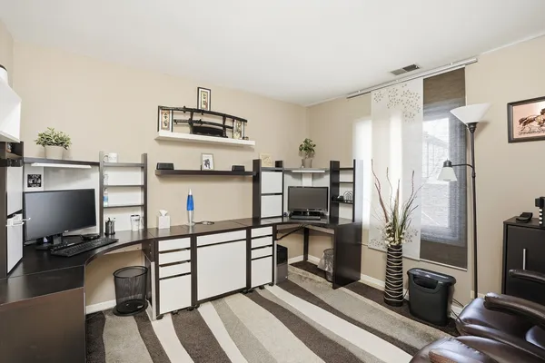 a kitchen with stainless steel appliances a sink stove and refrigerator
