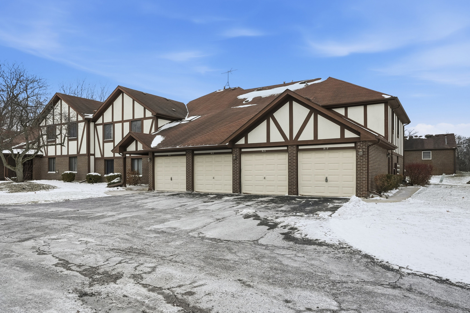 917 Patricia Lane, Unit 917 Crete, IL 60417 - Photo 17 of 17 a view of a house with a wooden fence
