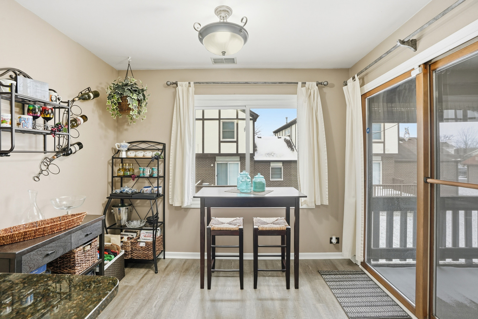 917 Patricia Lane, Unit 917 Crete, IL 60417 - Photo 7 of 17 a view of a dining room with furniture window and wooden floor