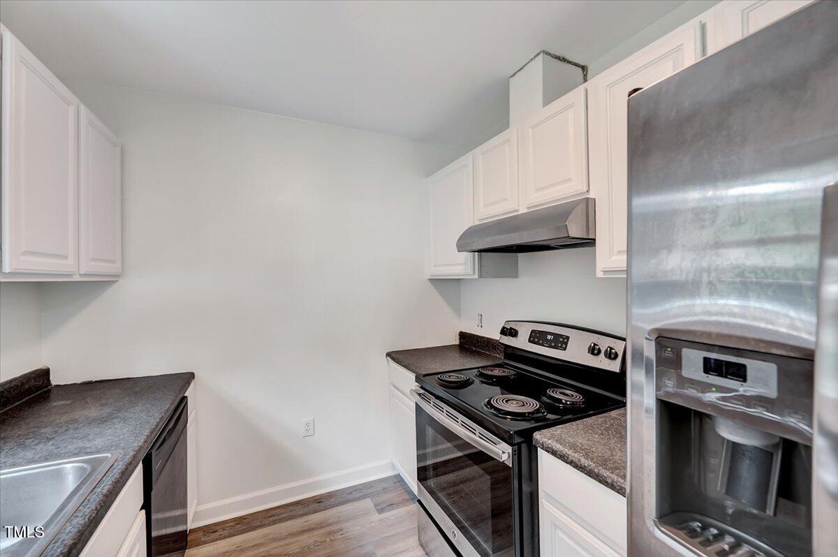 216 Katie Drive Rocky Mount, NC 27803 - Photo 13 of 27 a kitchen with a stove and a microwave