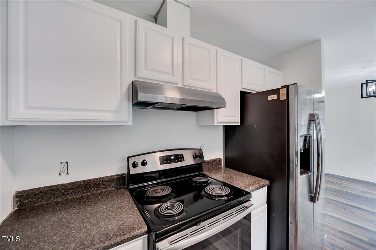 216 Katie Drive Rocky Mount, NC 27803 - Photo 16 of 27 a kitchen with stainless steel appliances granite countertop a stove a refrigerator and cabinets
