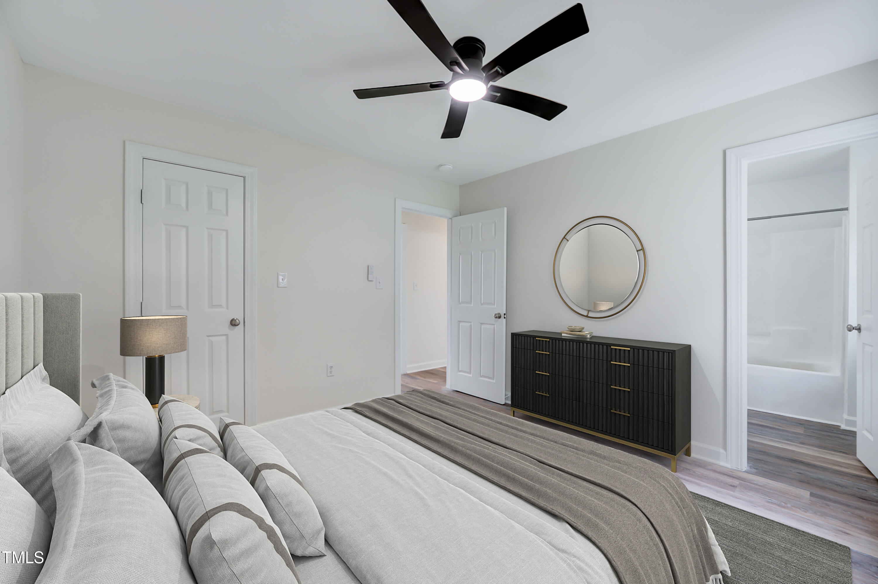 216 Katie Drive Rocky Mount, NC 27803 - Photo 24 of 27 a bedroom with a bed and wooden floor