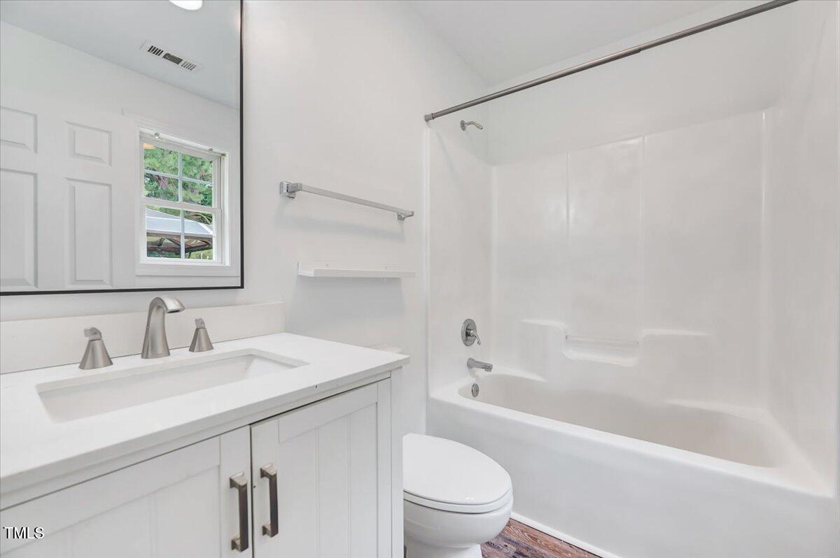 216 Katie Drive Rocky Mount, NC 27803 - Photo 27 of 27 a bathroom with a sink mirror toilet and bathtub