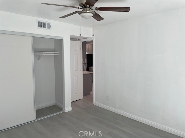 15721 Lakeridge Road, Unit ADU Lake Elsinore, CA 92530 - Photo 11 of 22 an empty room with a ceiling fan and a window