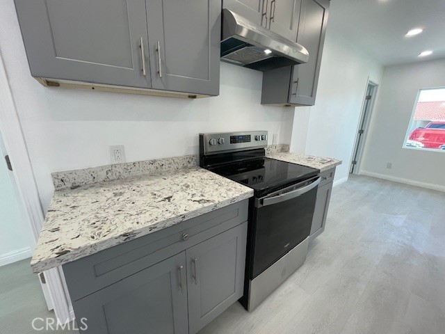15721 Lakeridge Road, Unit ADU Lake Elsinore, CA 92530 - Photo 5 of 22 a kitchen with granite countertop cabinets and steel stainless steel appliances