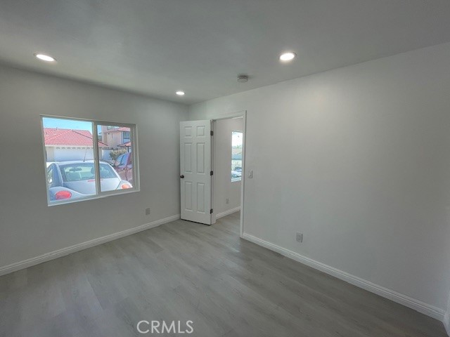 15721 Lakeridge Road, Unit ADU Lake Elsinore, CA 92530 - Photo 10 of 22 an empty room with windows & cabinet