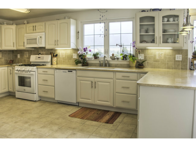 3481 Oliver Road Carmel, CA 93923 - Photo 3 of 18 a kitchen with cabinets appliances and a window