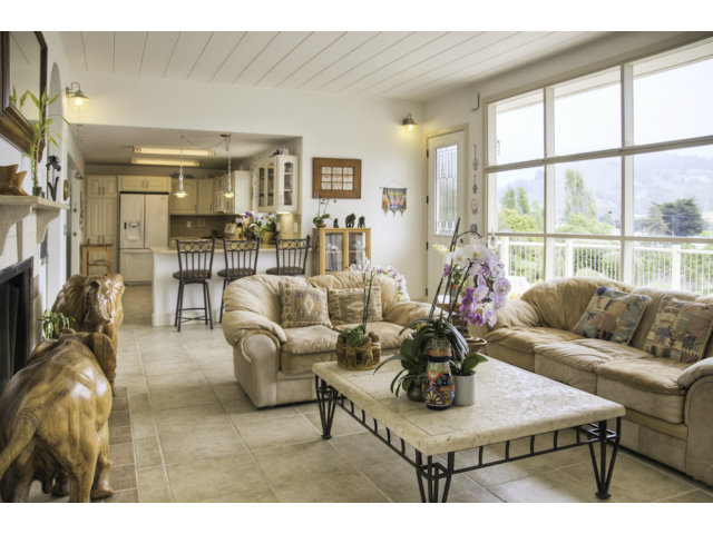 3481 Oliver Road Carmel, CA 93923 - Photo 6 of 18 a living room with furniture a chandelier and a dining table