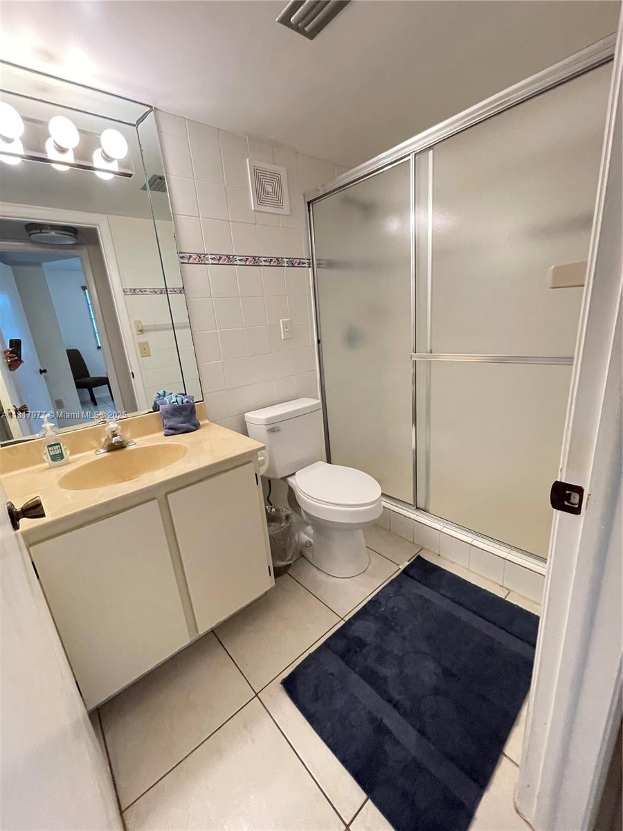 4000 Crystal Lake Drive, Unit 111 Deerfield Beach, FL 33064 - Photo 19 of 26 a bathroom with a sink toilet and shower
