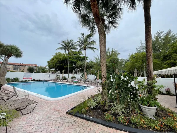 a view of a swimming pool with a sitting area
