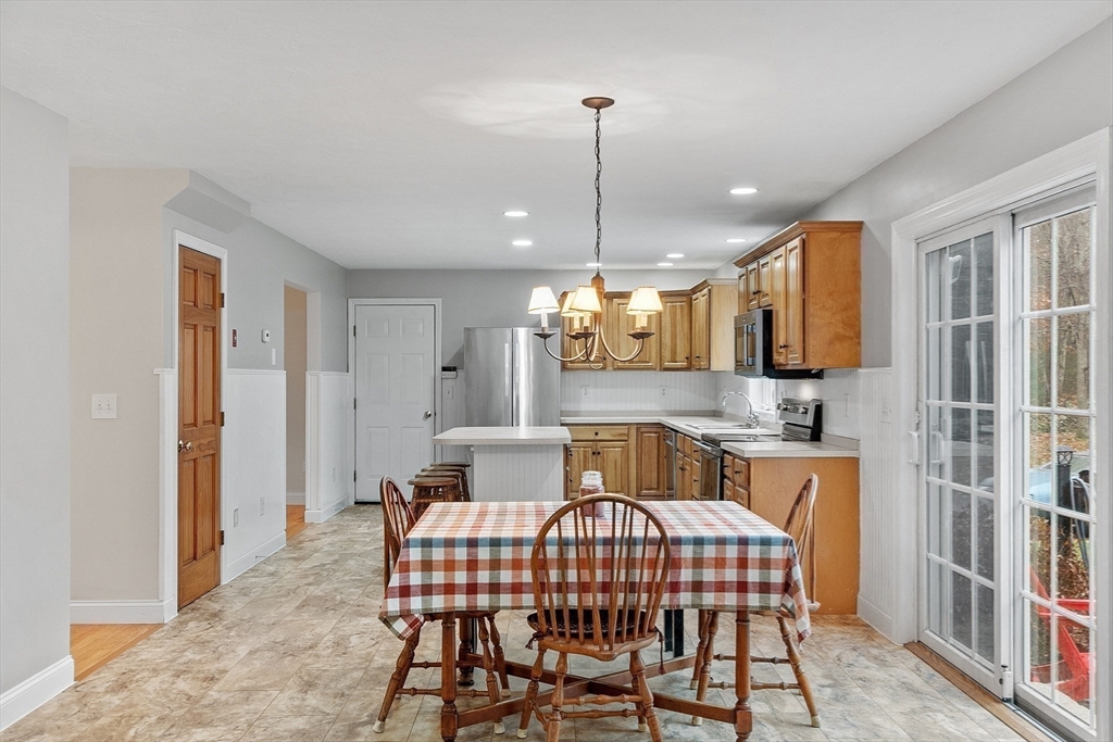 32 Simonds Hill Road Hubbardston, MA 01452 - Photo 14 of 42 a view of a kitchen with a table and chairs