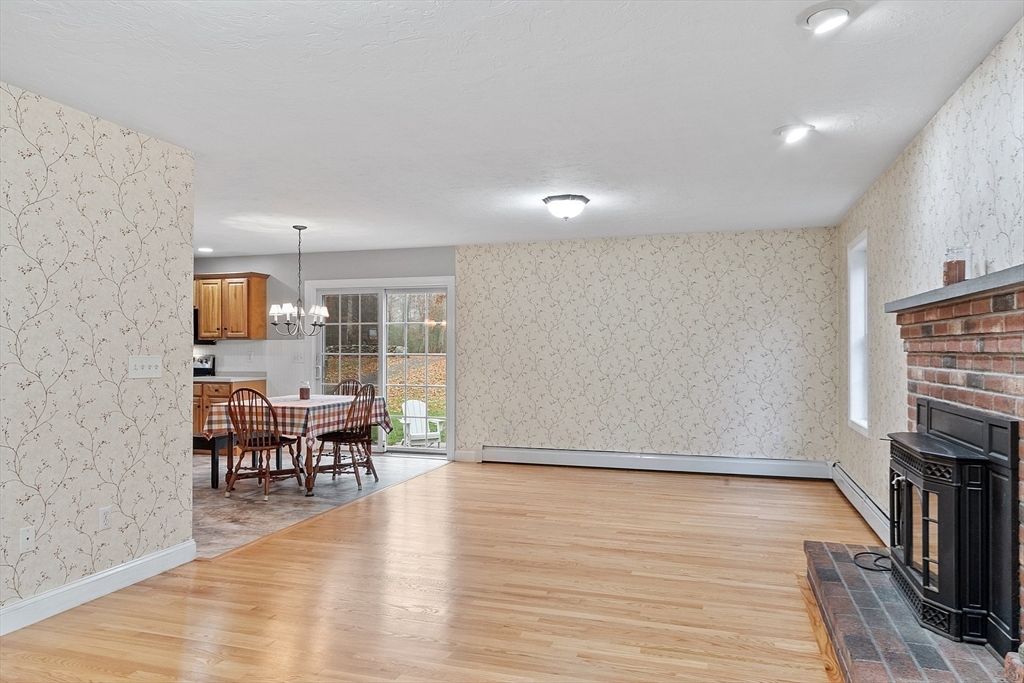 32 Simonds Hill Road Hubbardston, MA 01452 - Photo 16 of 42 an empty room with wooden floor and furniture