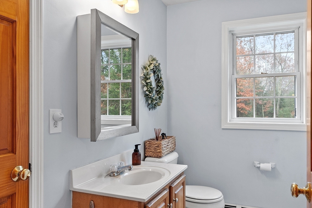 32 Simonds Hill Road Hubbardston, MA 01452 - Photo 21 of 42 a bathroom with a sink toilet and a mirror