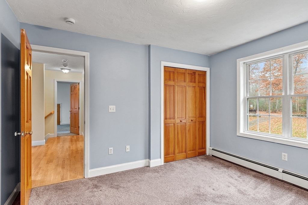 32 Simonds Hill Road Hubbardston, MA 01452 - Photo 26 of 42 an empty room with windows and closet