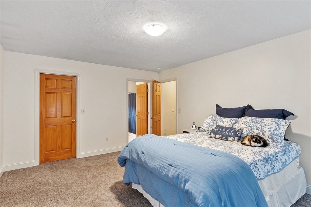 32 Simonds Hill Road Hubbardston, MA 01452 - Photo 28 of 42 a bedroom with a bed and a dresser