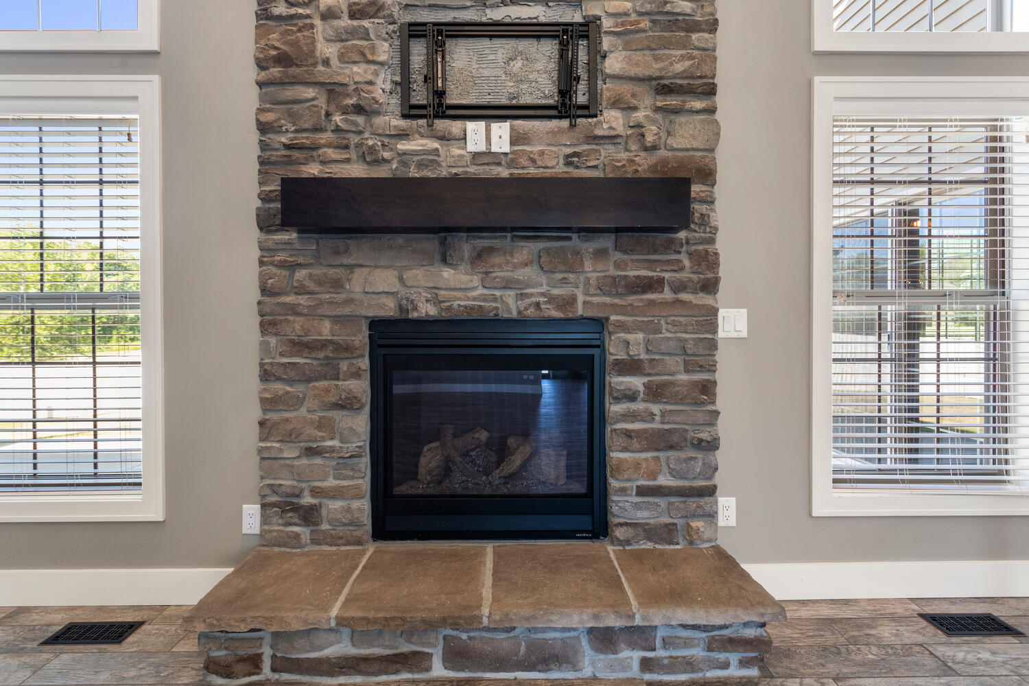 1101 Cascade Drive Savoy, IL 61874 - Photo 12 of 55 a living room with a fireplace and a window