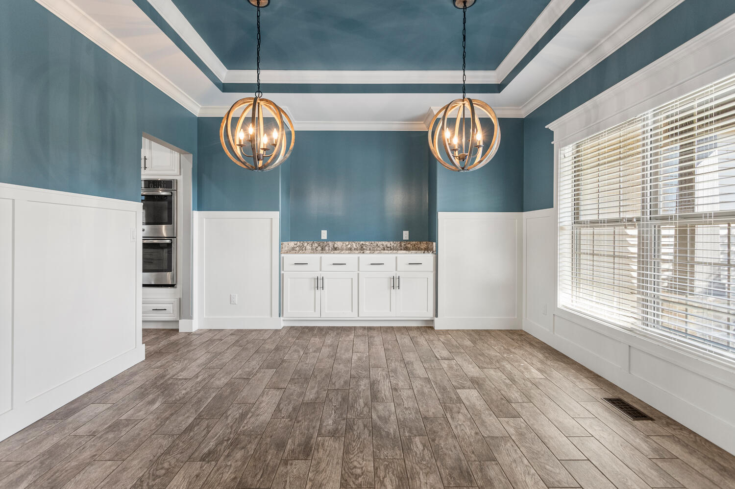 1101 Cascade Drive Savoy, IL 61874 - Photo 13 of 55 a view of kitchen with wooden floor cabinets and stainless steel appliances