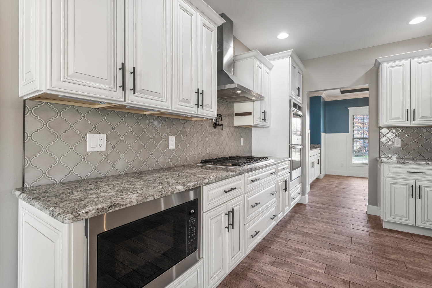 1101 Cascade Drive Savoy, IL 61874 - Photo 18 of 55 a kitchen with stainless steel appliances granite countertop a stove a sink and a microwave