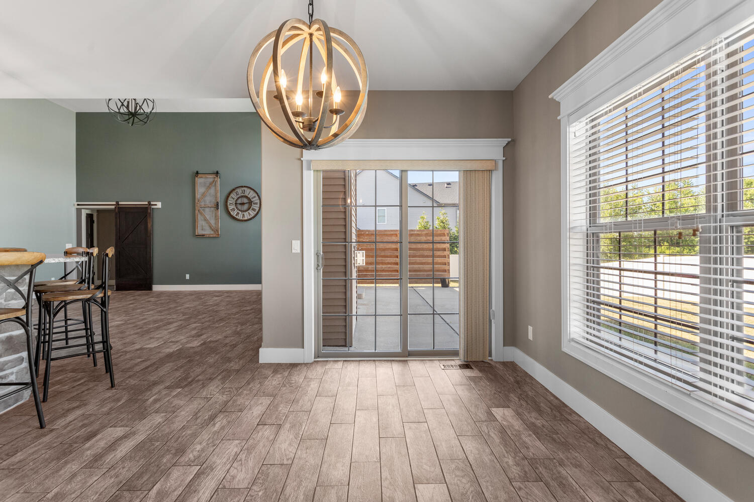1101 Cascade Drive Savoy, IL 61874 - Photo 19 of 55 a view of empty room with wooden floor and fan