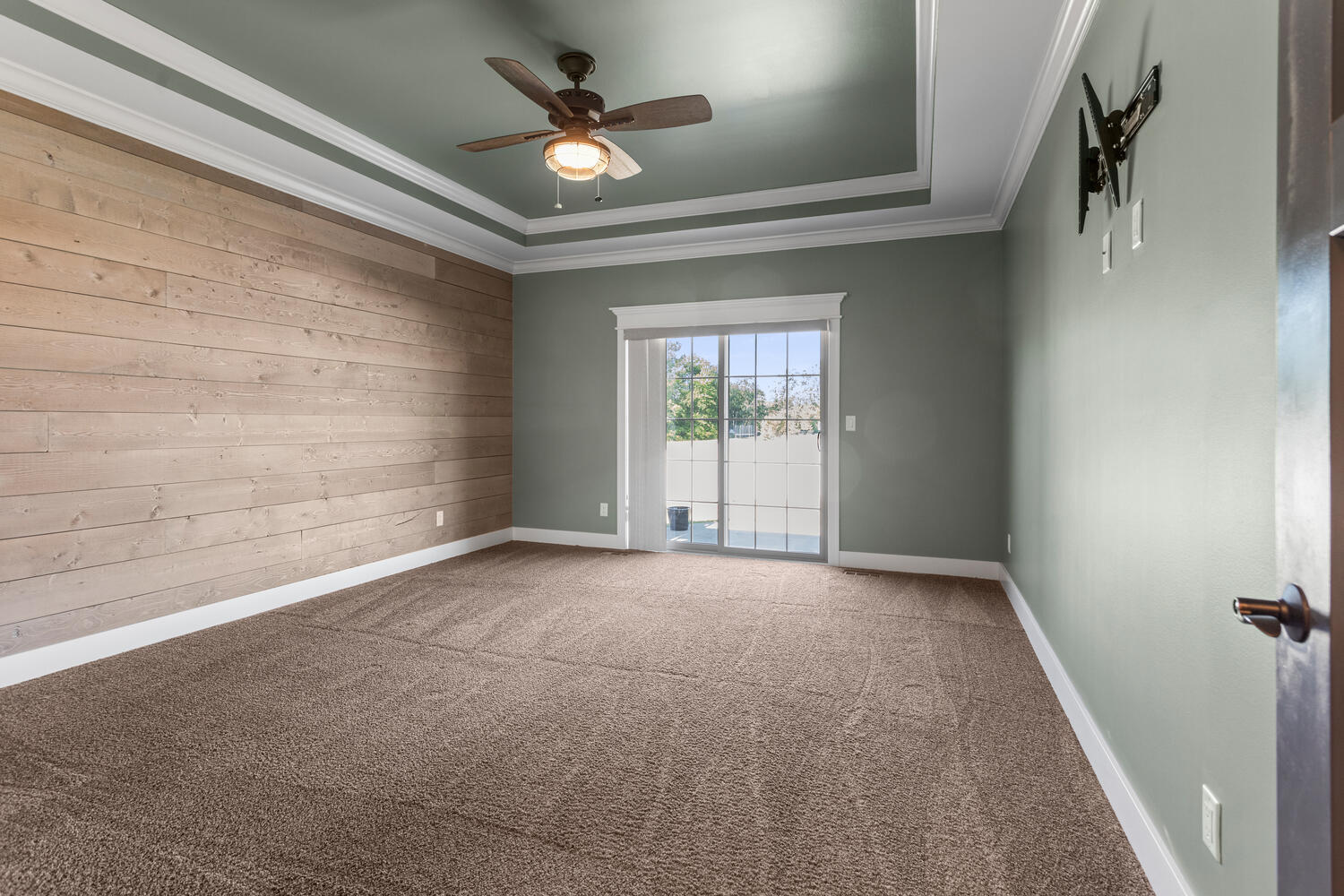 1101 Cascade Drive Savoy, IL 61874 - Photo 20 of 55 en empty room with windows and ceiling fan