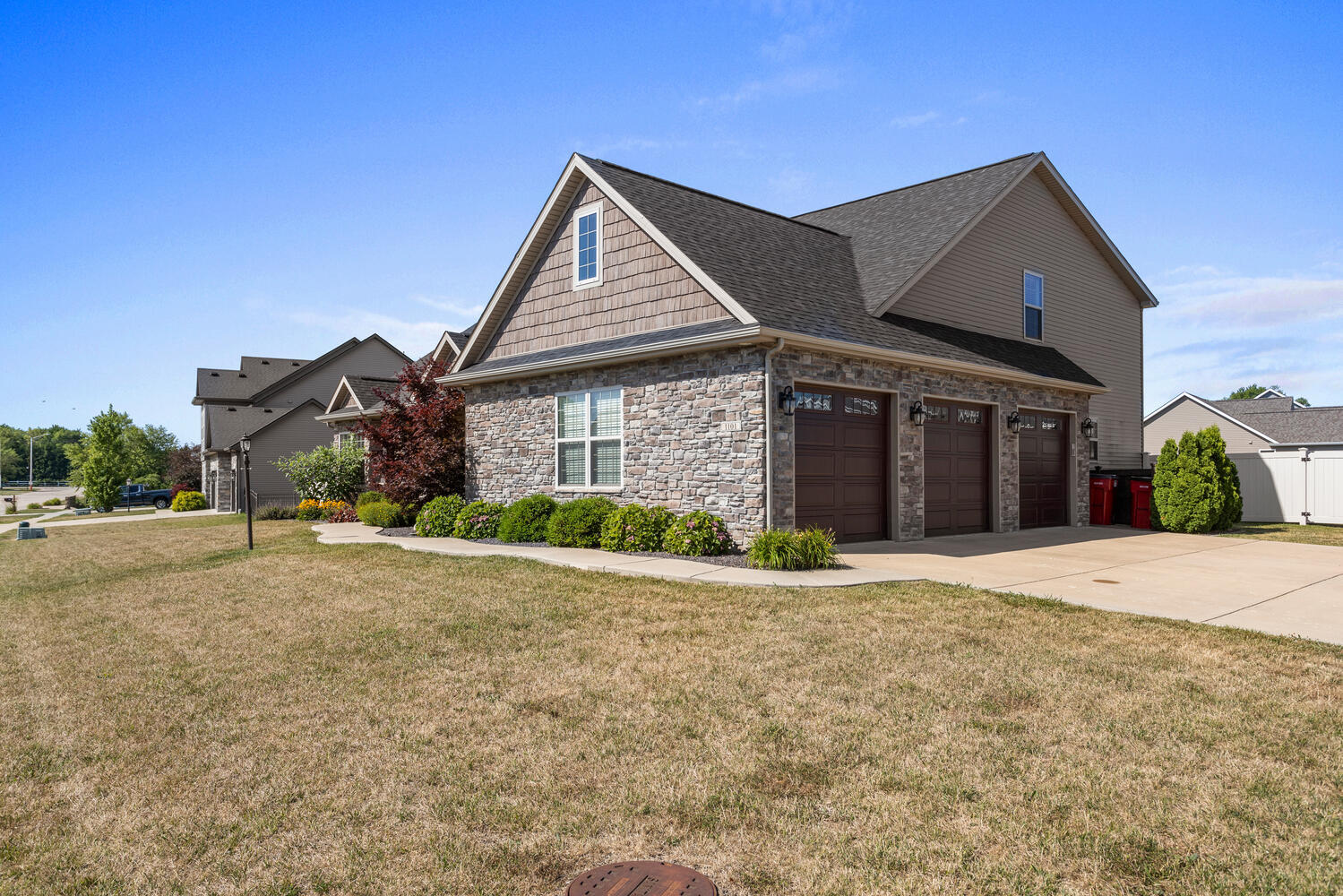 1101 Cascade Drive Savoy, IL 61874 - Photo 2 of 55 a front view of a house with a yard and garage