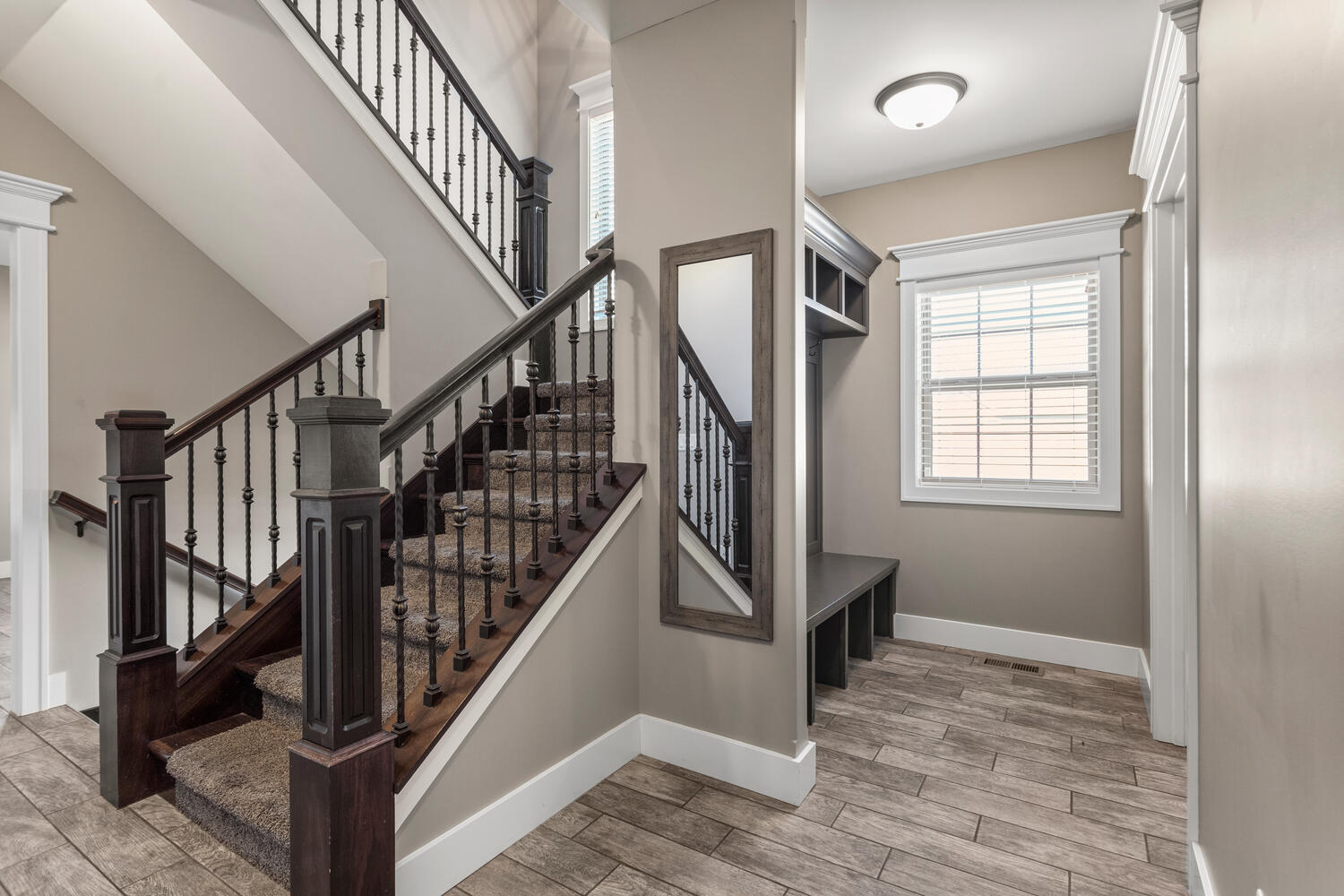 1101 Cascade Drive Savoy, IL 61874 - Photo 25 of 55 a view of staircase with wooden floor and a window