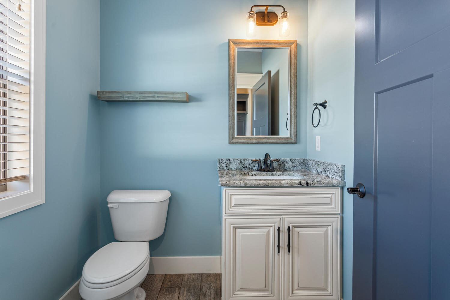 1101 Cascade Drive Savoy, IL 61874 - Photo 28 of 55 a bathroom with a toilet sink vanity and mirror