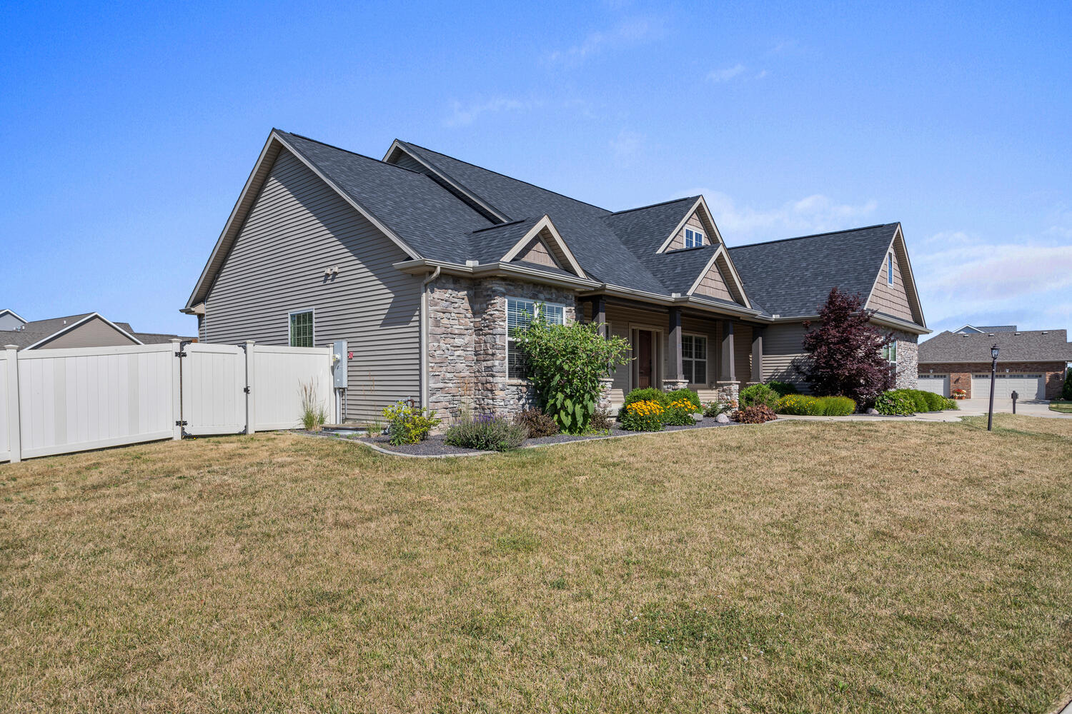 1101 Cascade Drive Savoy, IL 61874 - Photo 3 of 55 a front view of a house with a yard and garage
