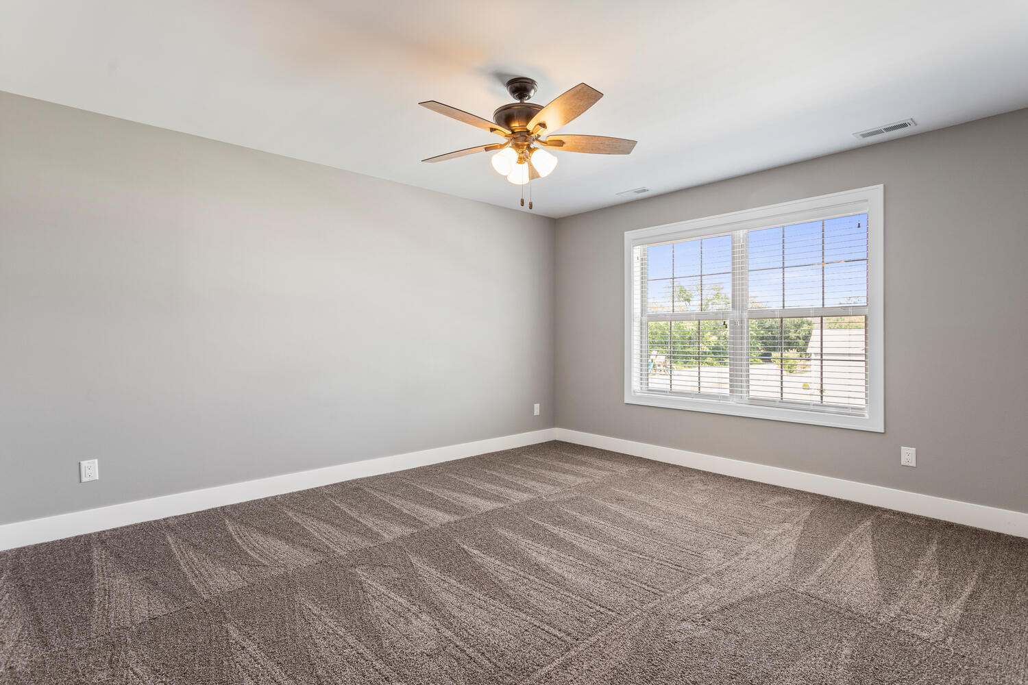 1101 Cascade Drive Savoy, IL 61874 - Photo 35 of 55 a view of a livingroom with a ceiling fan and window