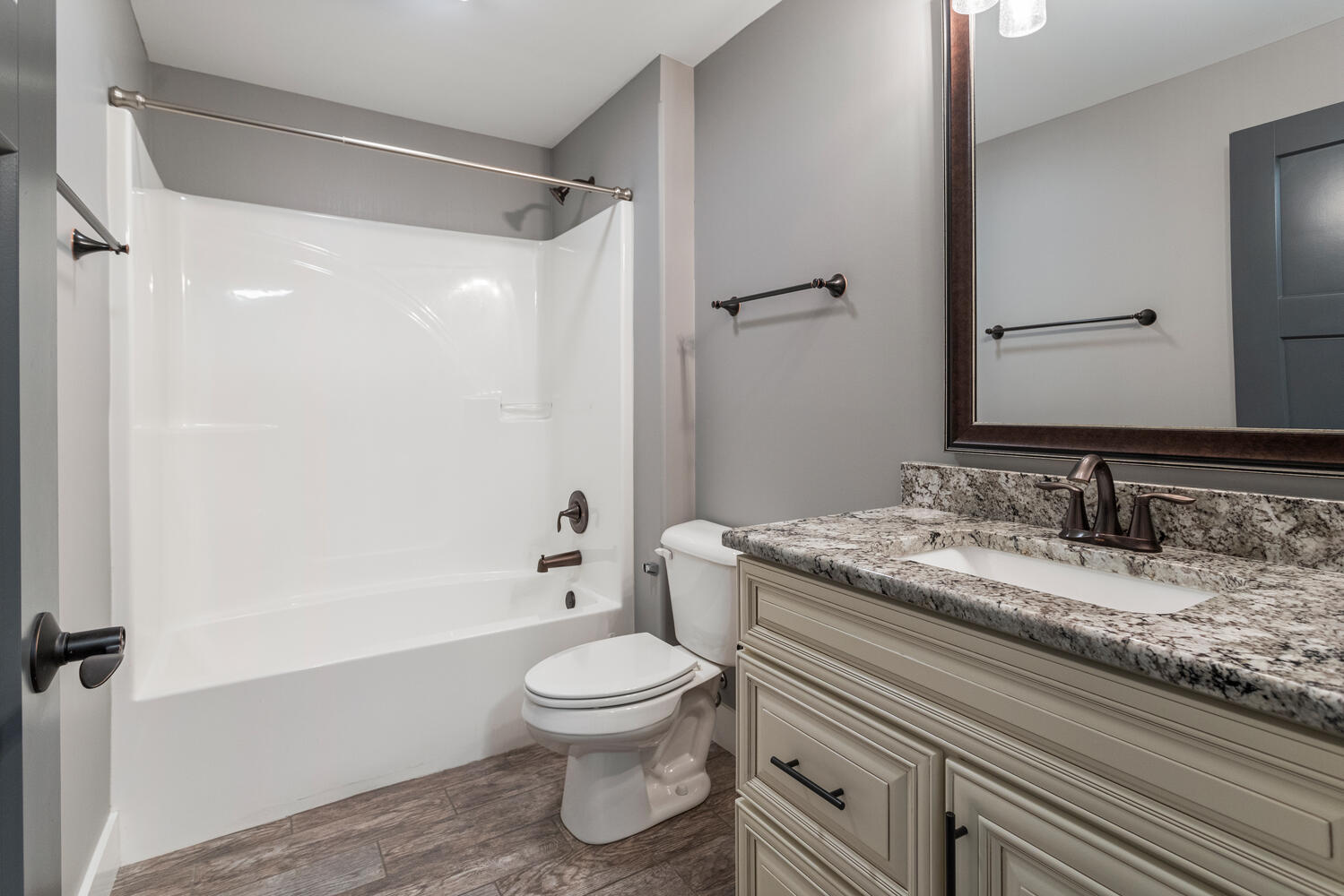 1101 Cascade Drive Savoy, IL 61874 - Photo 45 of 55 a bathroom with a granite countertop sink toilet and shower