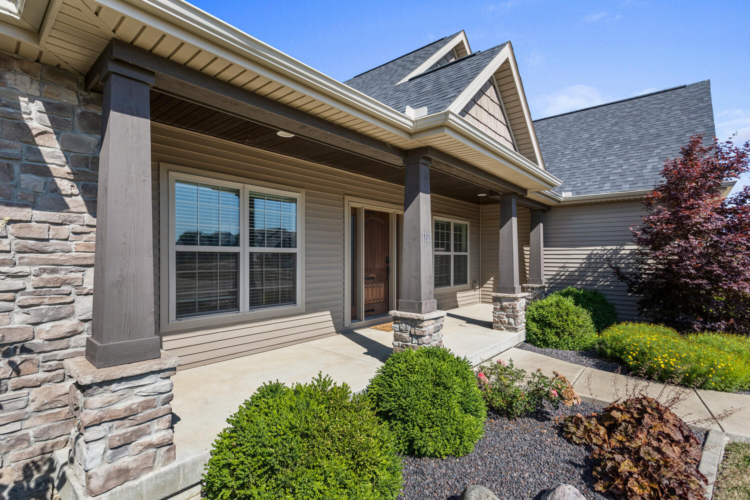 1101 Cascade Drive Savoy, IL 61874 - Photo 5 of 55 a front view of a house with a yard outdoor seating and garage