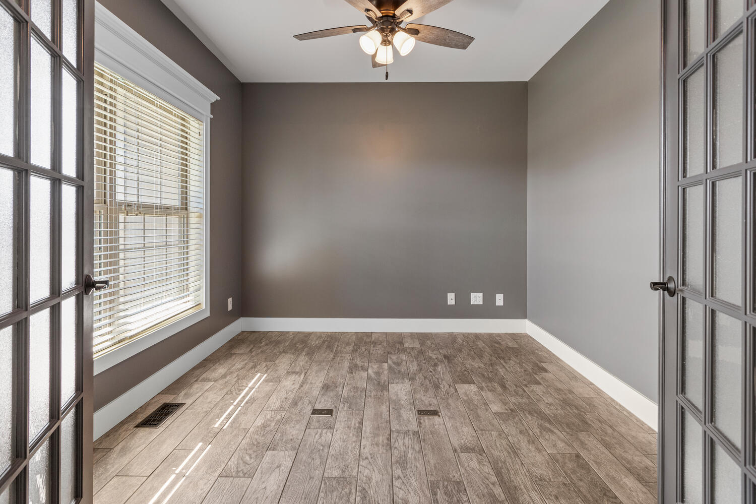 1101 Cascade Drive Savoy, IL 61874 - Photo 8 of 55 a view of a livingroom with a ceiling fan and window