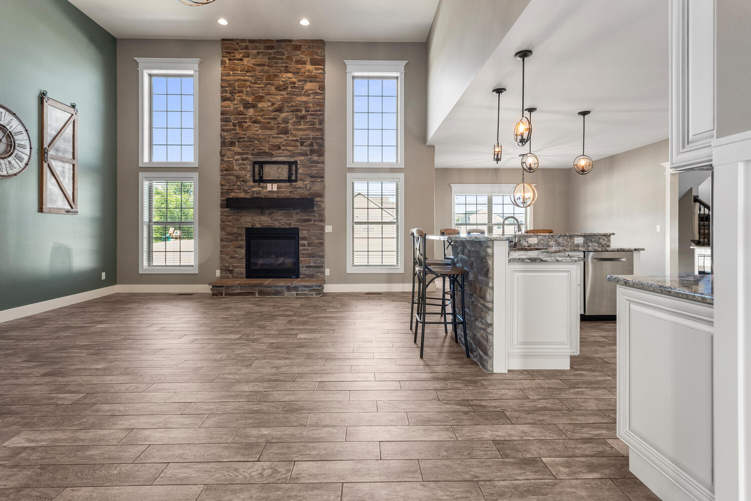 1101 Cascade Drive Savoy, IL 61874 - Photo 9 of 55 a kitchen with stainless steel appliances granite countertop a stove refrigerator and a fireplace