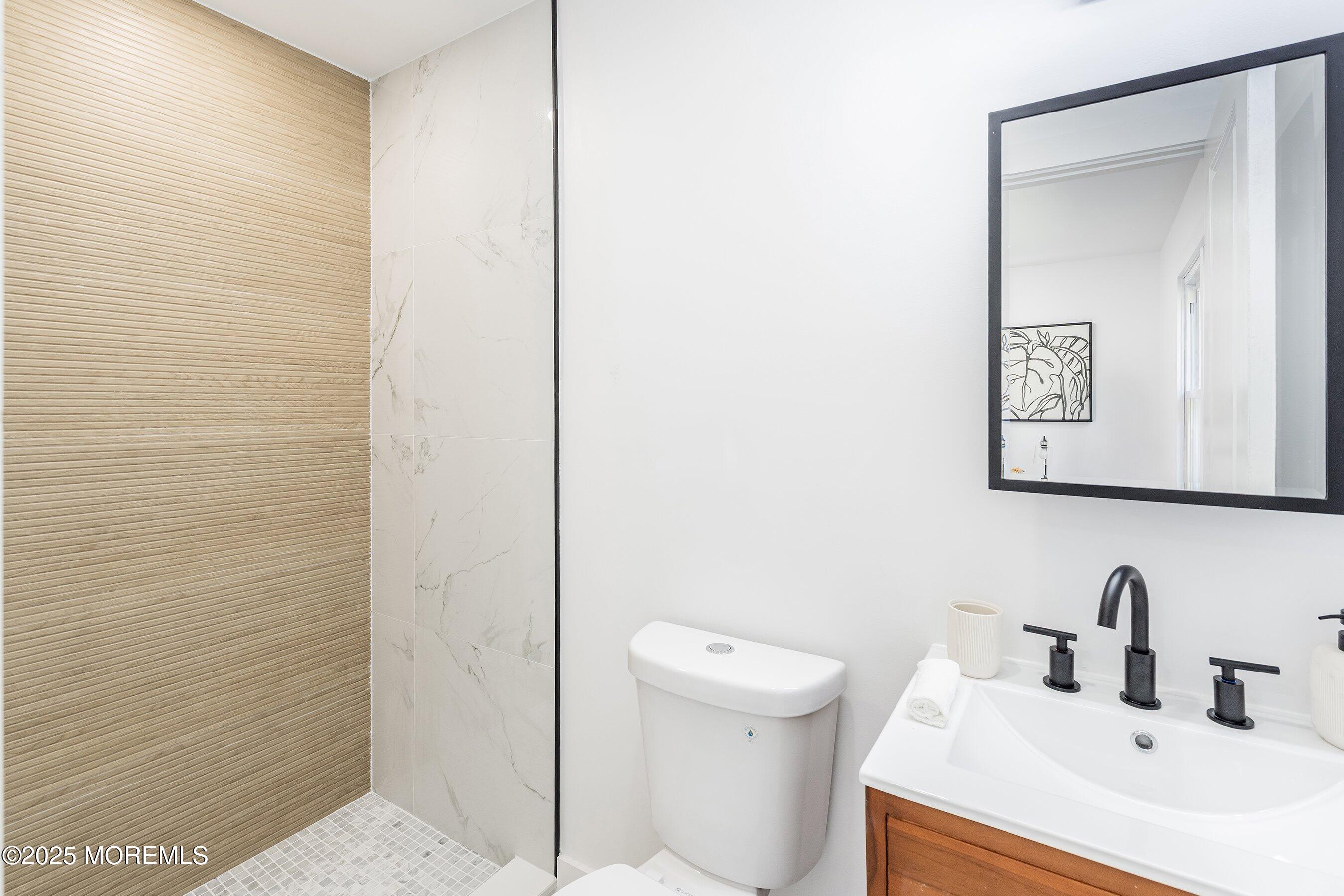 11 Malsbury Lane Cream Ridge, NJ 08514 - Photo 11 of 17 a bathroom with a sink and a toilet