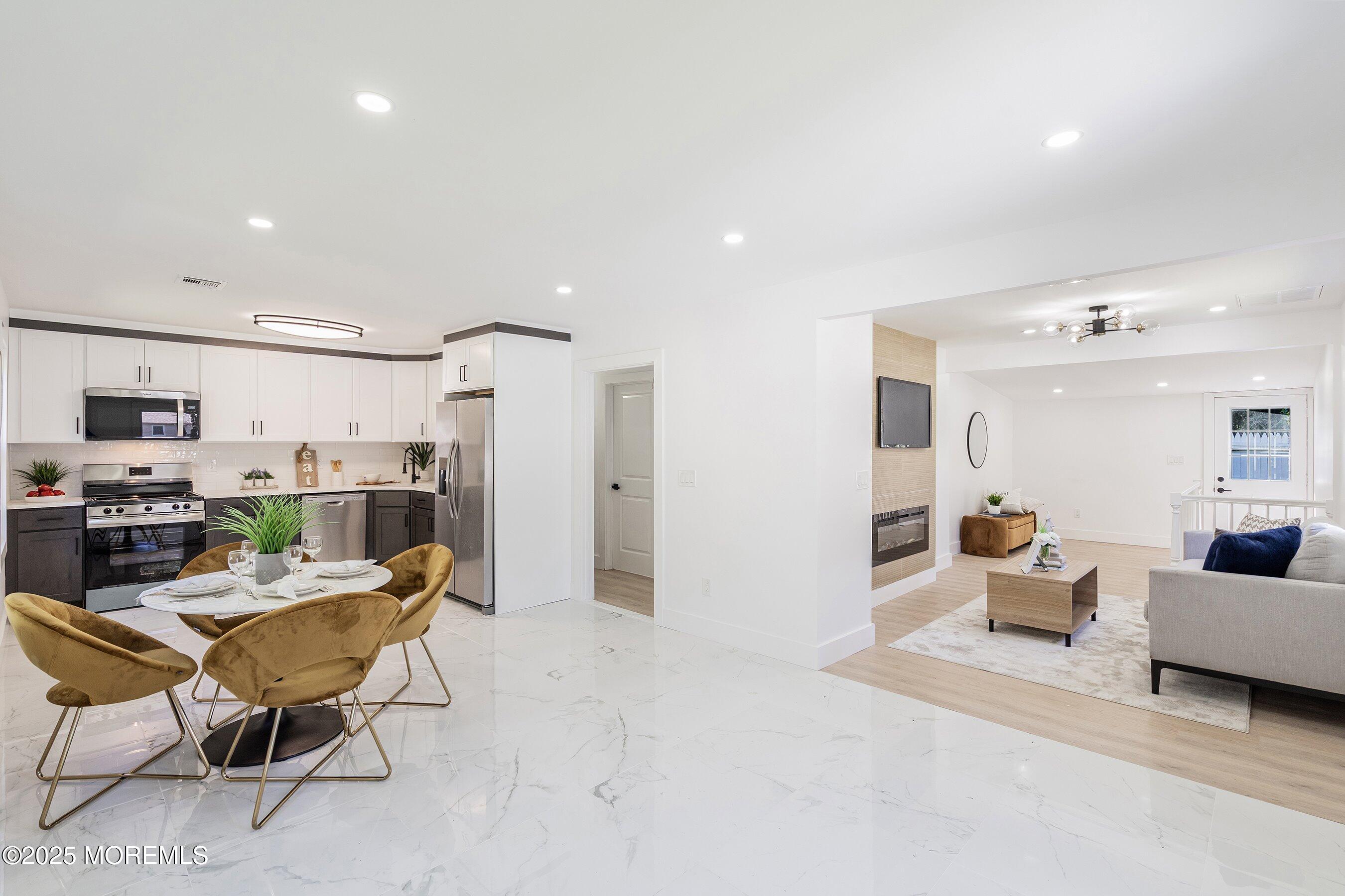 11 Malsbury Lane Cream Ridge, NJ 08514 - Photo 3 of 17 a living room with furniture and kitchen view