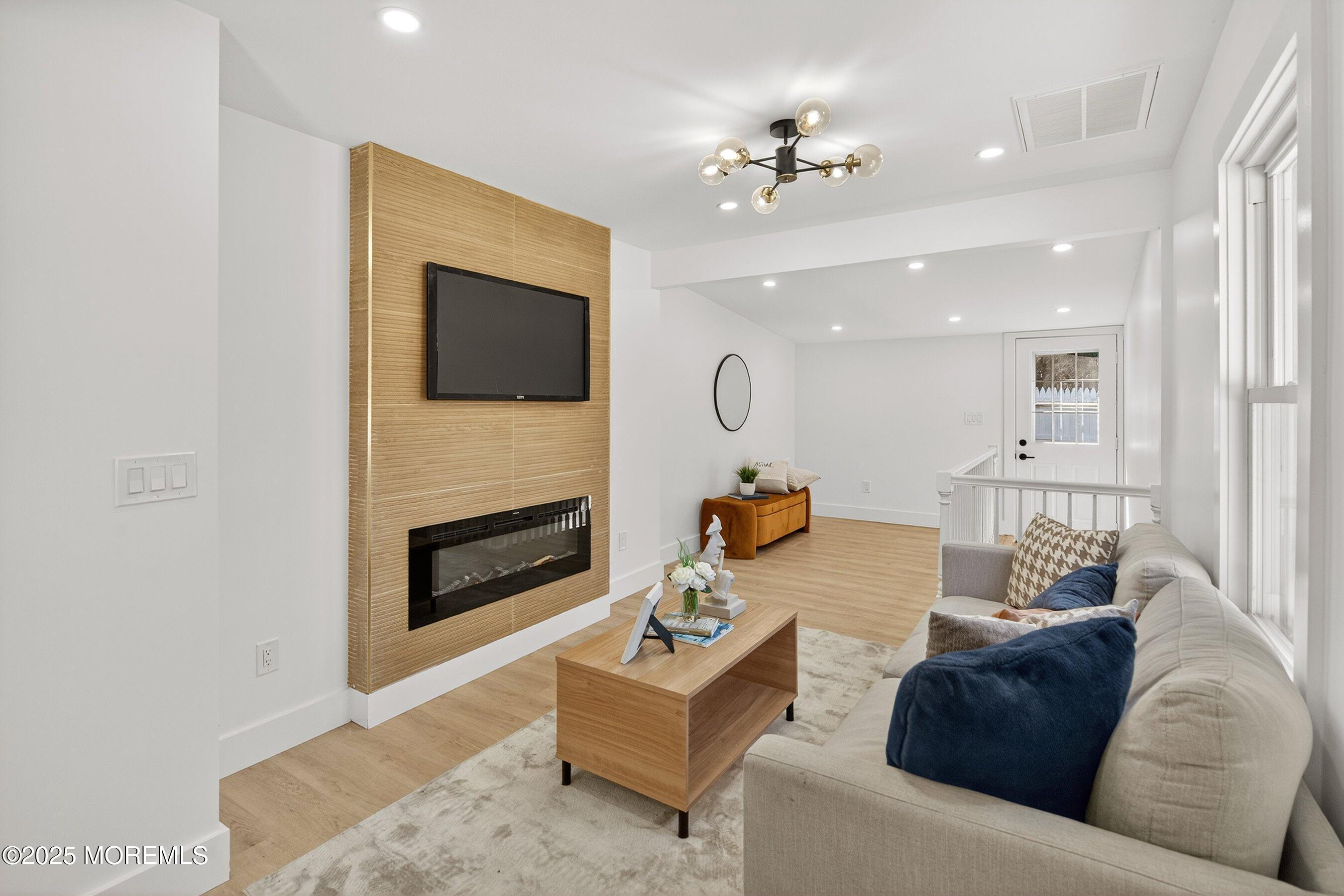 11 Malsbury Lane Cream Ridge, NJ 08514 - Photo 4 of 17 a living room with furniture and a fireplace
