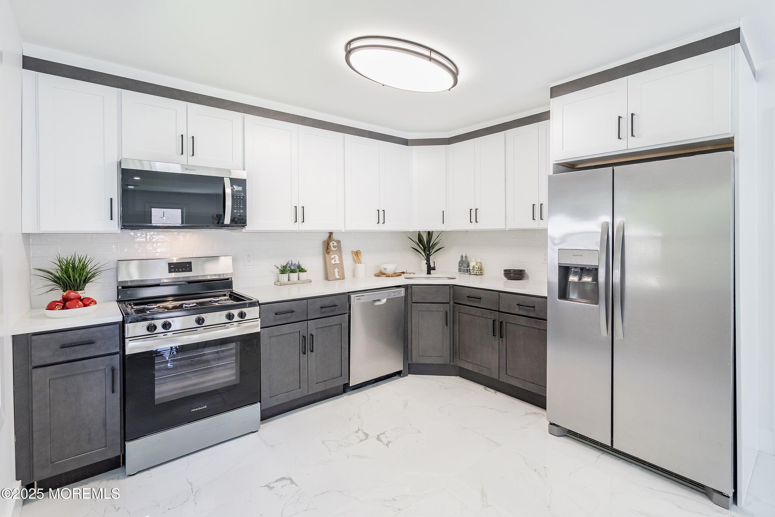 11 Malsbury Lane Cream Ridge, NJ 08514 - Photo 5 of 17 a kitchen with cabinets stainless steel appliances and a counter space